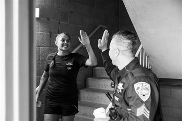 Two Police Officers high-fiving at staircase during 9/11 Stair Climb 