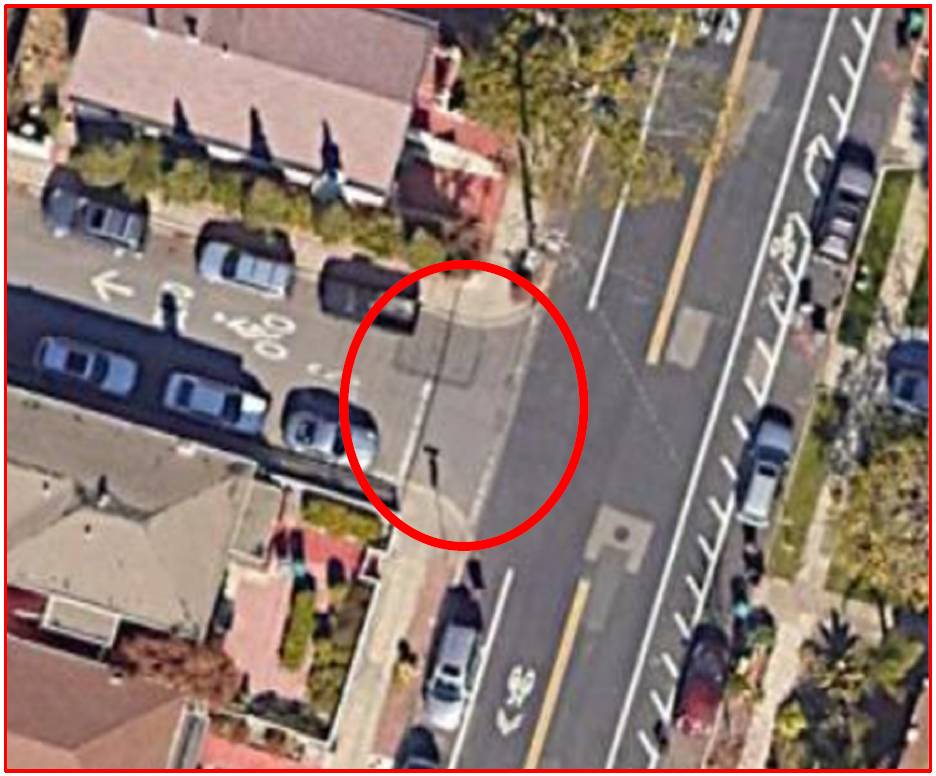 Circled area of road and pavement